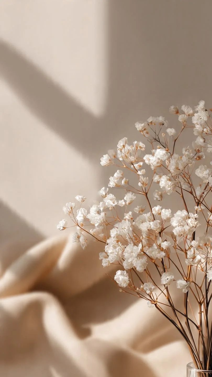 Soft white blossoms on a warm neutral backdrop at All About Monroe in Demorest, Georgia