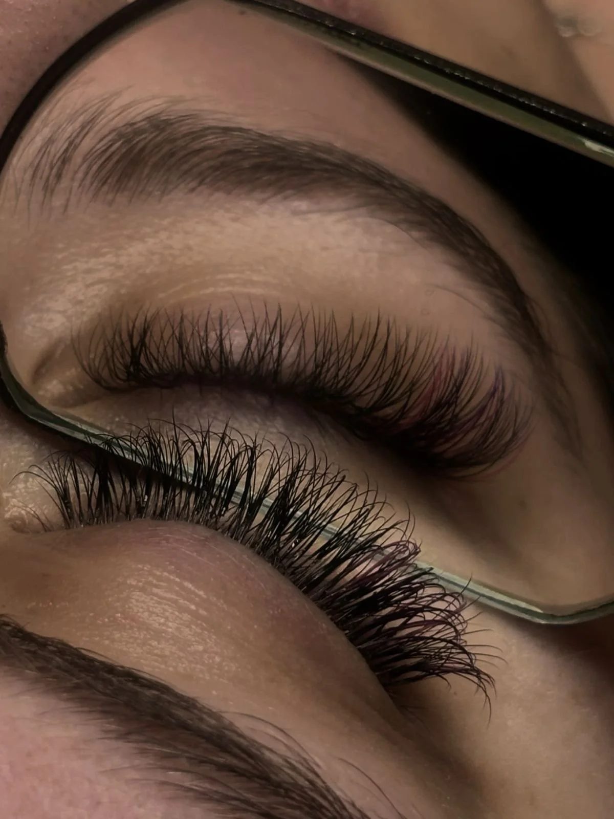 Close-up of individual lash extensions applied at All About Monroe in Demorest, Georgia