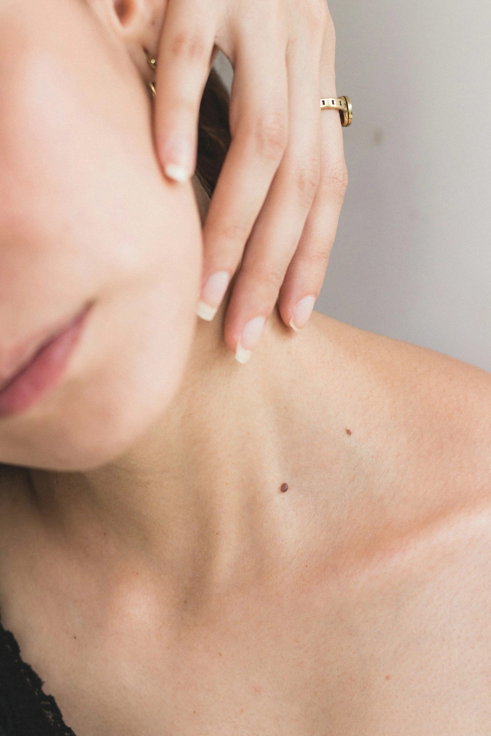 Close-up of clear skin across the neck and shoulder, representing peptide therapy outcomes