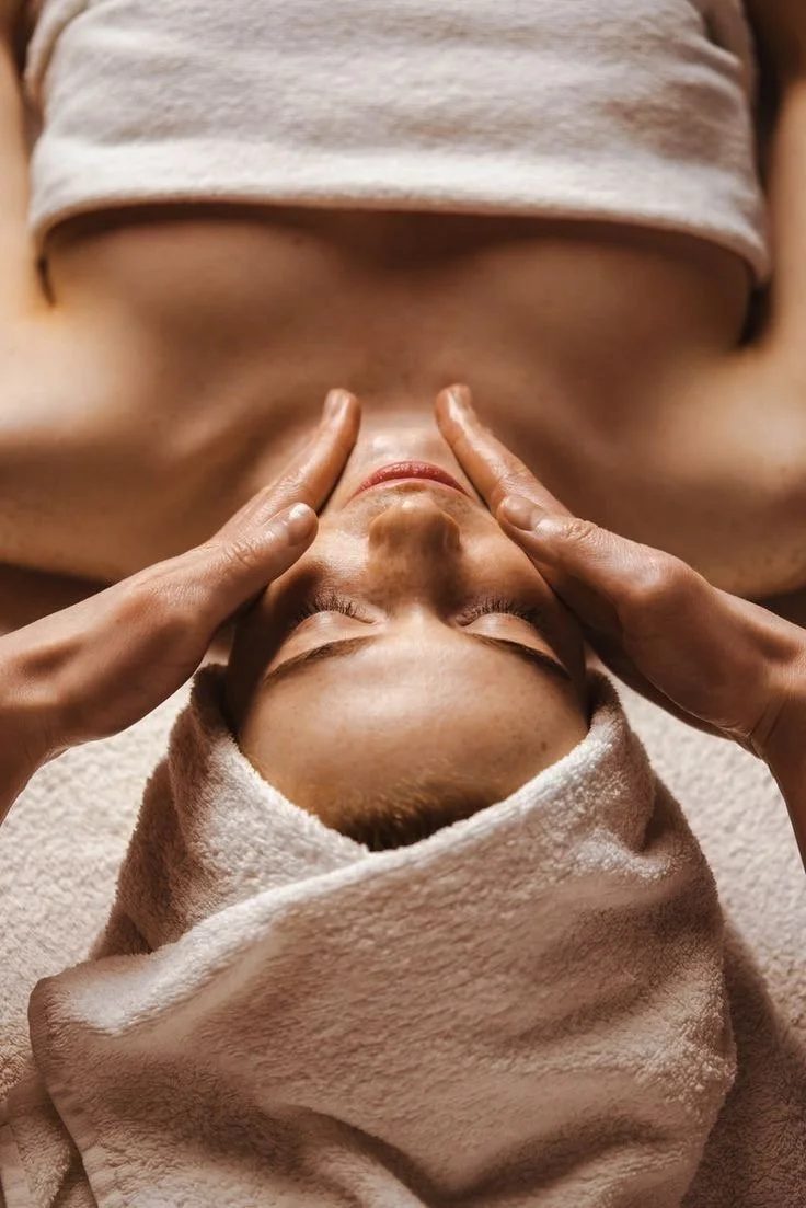 Therapist giving a hands-on treatment in the private suite at All About Monroe in Demorest, Georgia